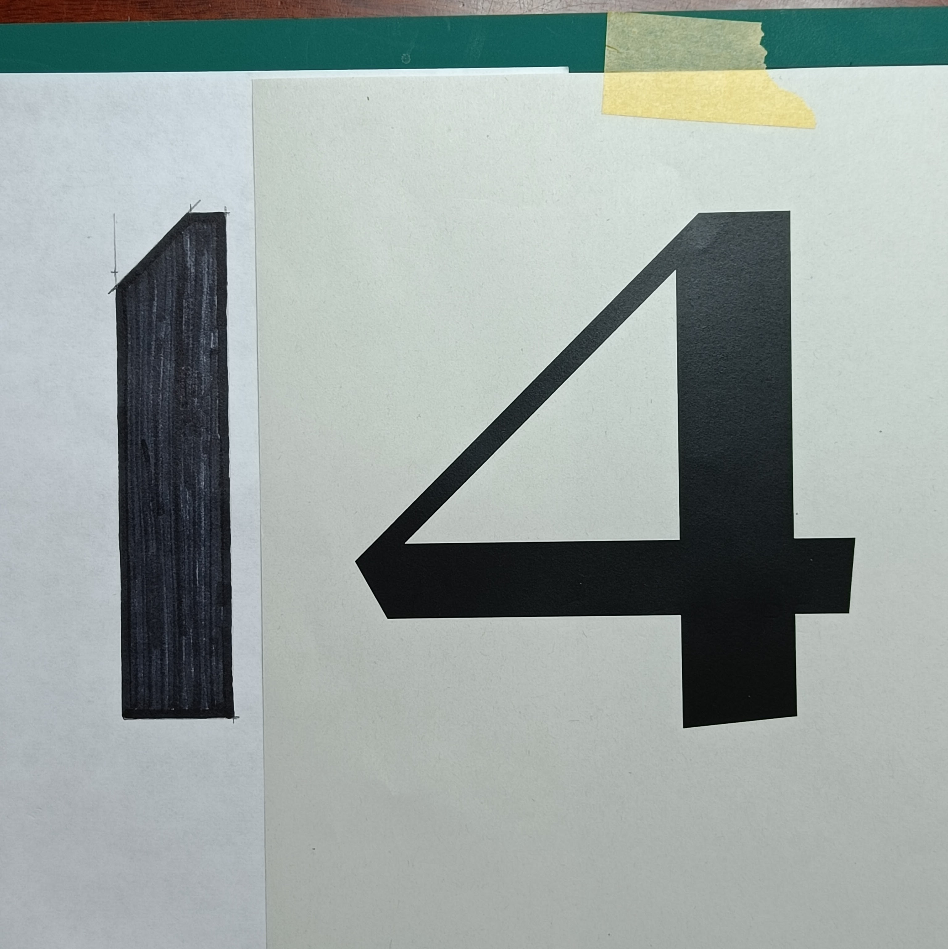 A large «14» on white paper. The «1» has been drawn with
  a marker pen; the «4» to its right is on another piece of
  paper and has been laser printed